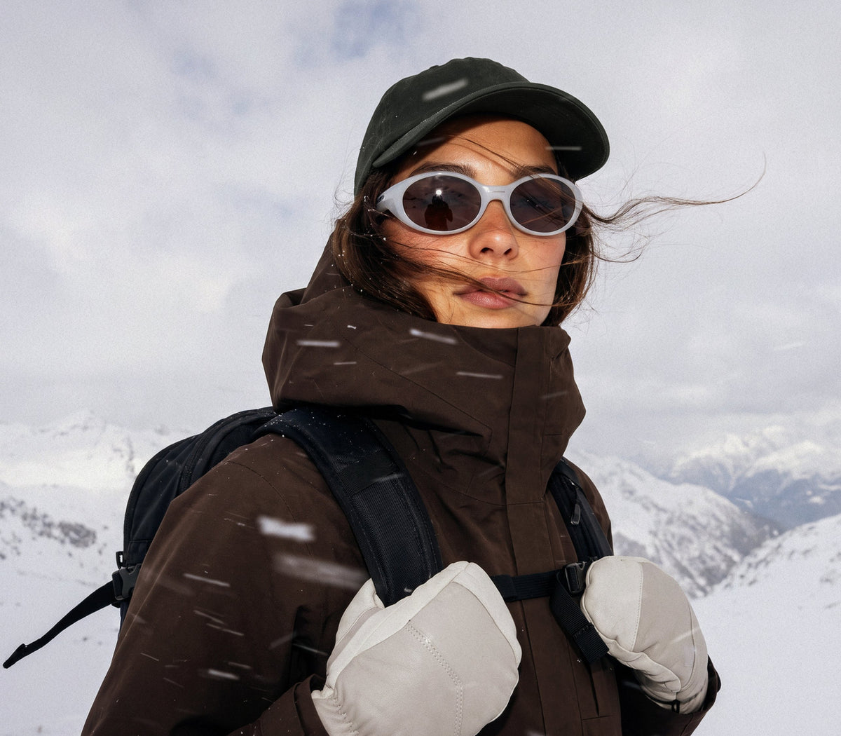 A woman in dark glasses and a brown Houdini Rollercoaster rented from Cirkel Supply